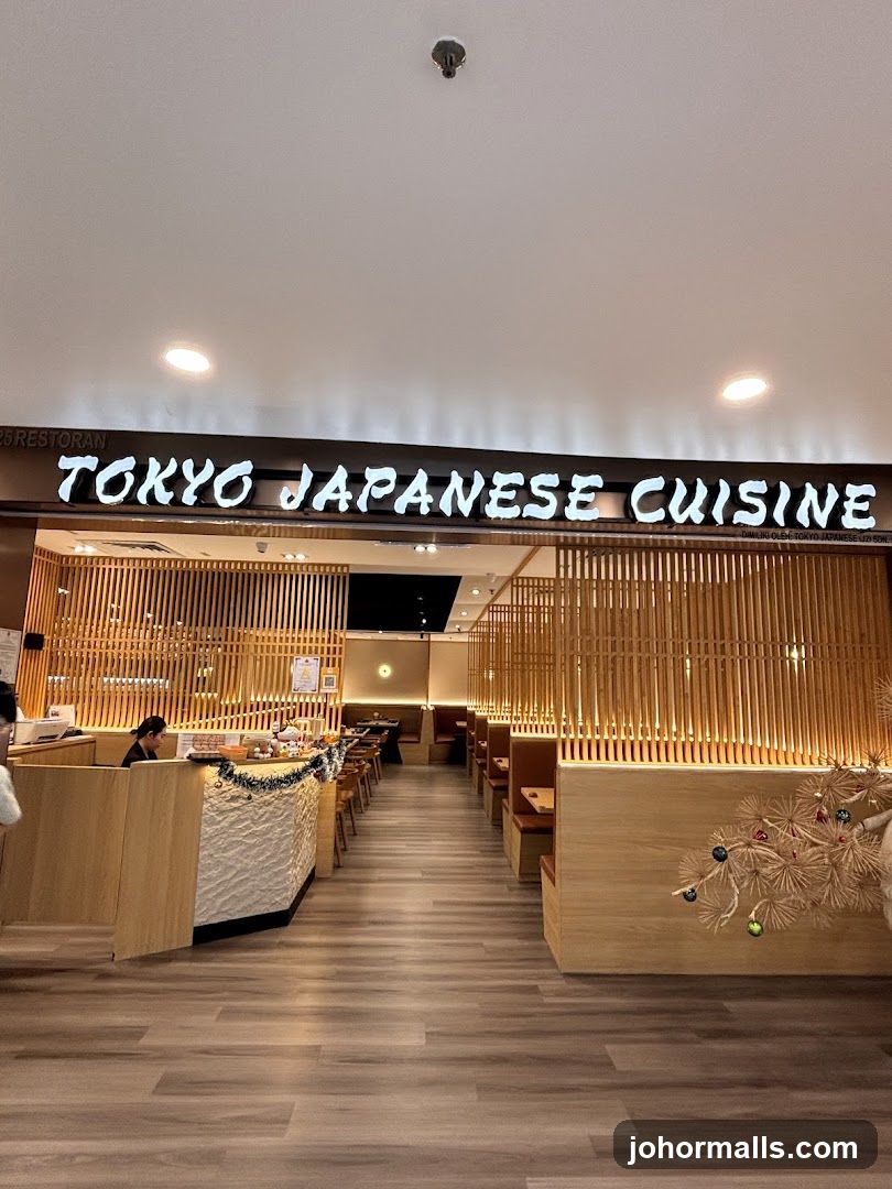 The exterior of a Japanese restaurant with a prominent sign that reads "TOKYO JAPANESE CUISINE". The entrance features wooden paneling and booth seating visible inside.