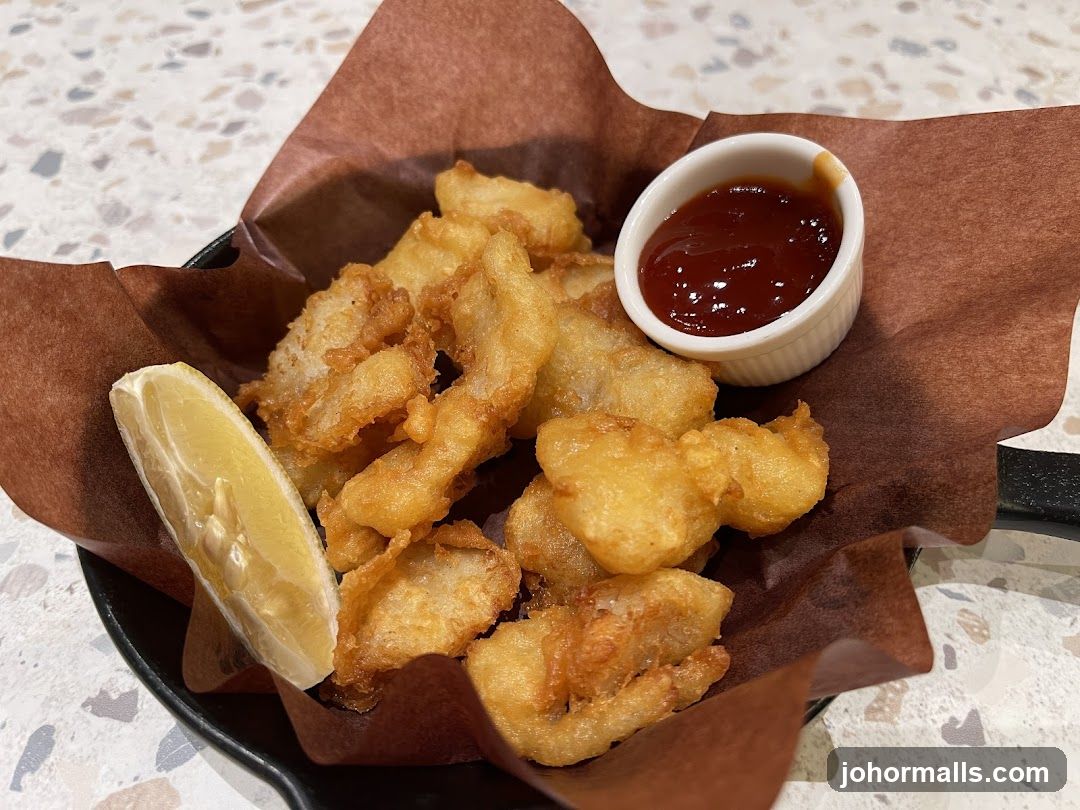 Fried Fish Bites with Lemon and Ketchup
