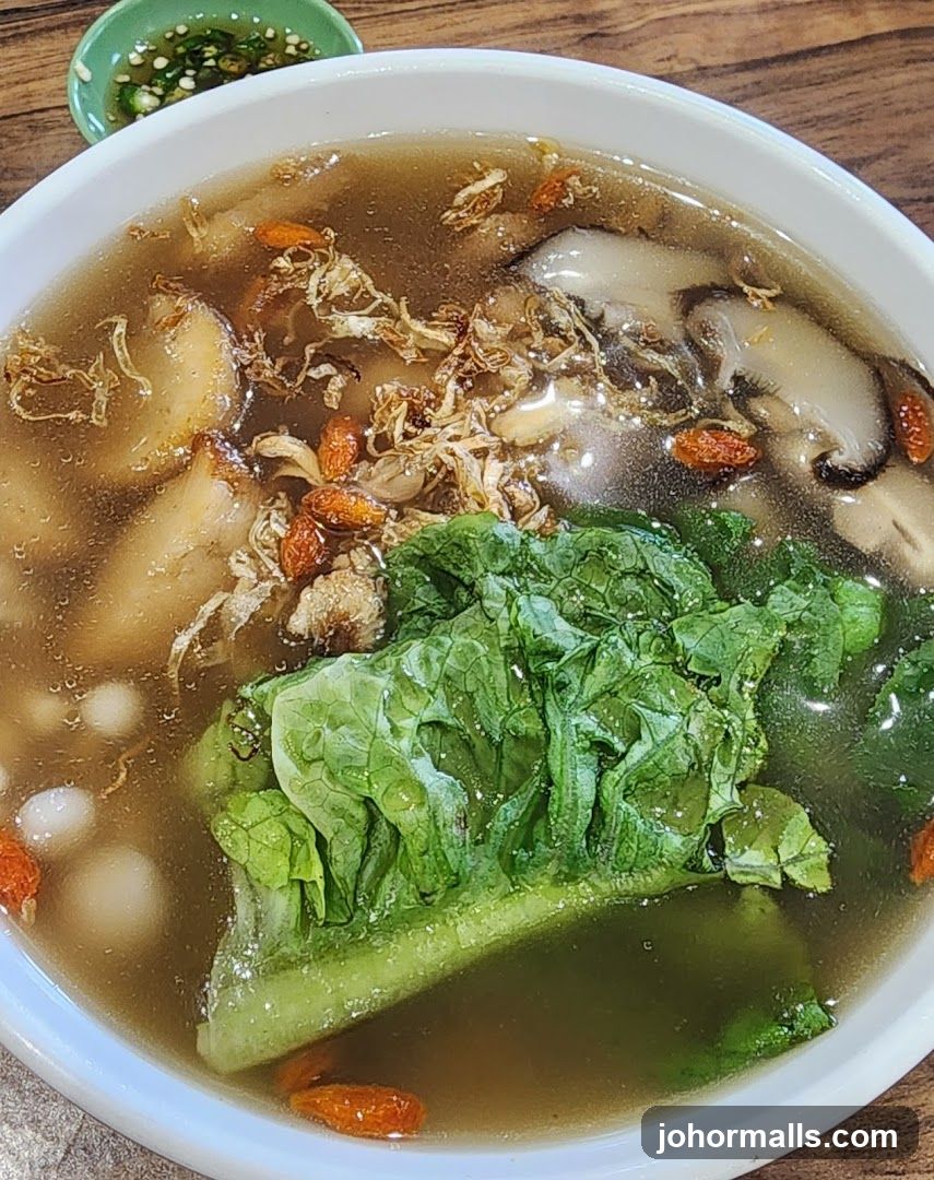 Bowl of Soup with Vegetables and Meat