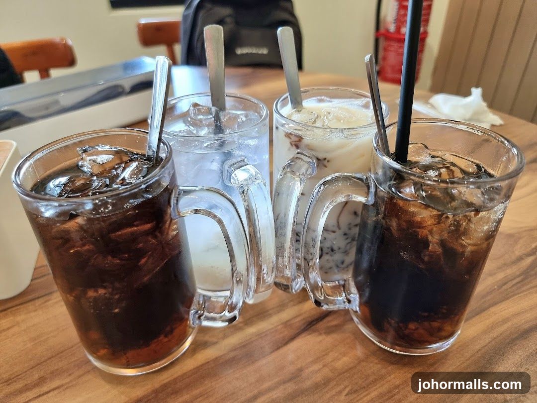 Four Iced Drinks on a Wooden Table