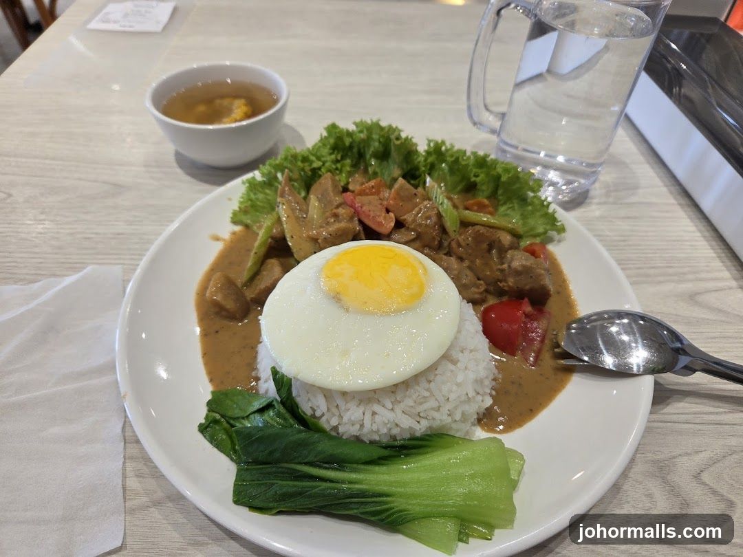 Rice dish with fried egg and vegetables