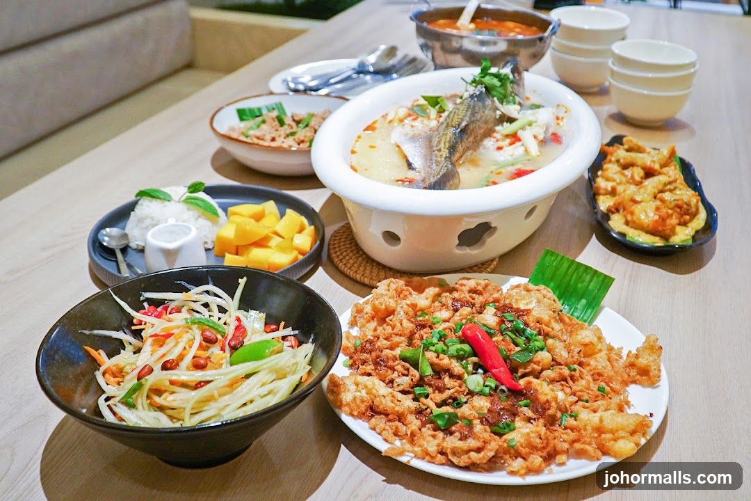 Table with Thai dishes