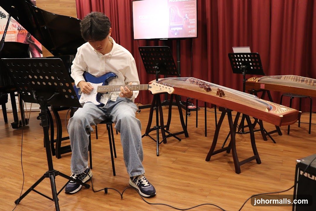 Musician practicing guitar in concert venue