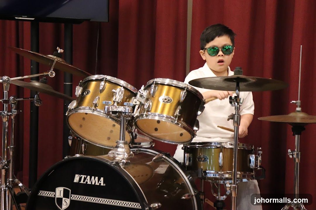 Child playing drums