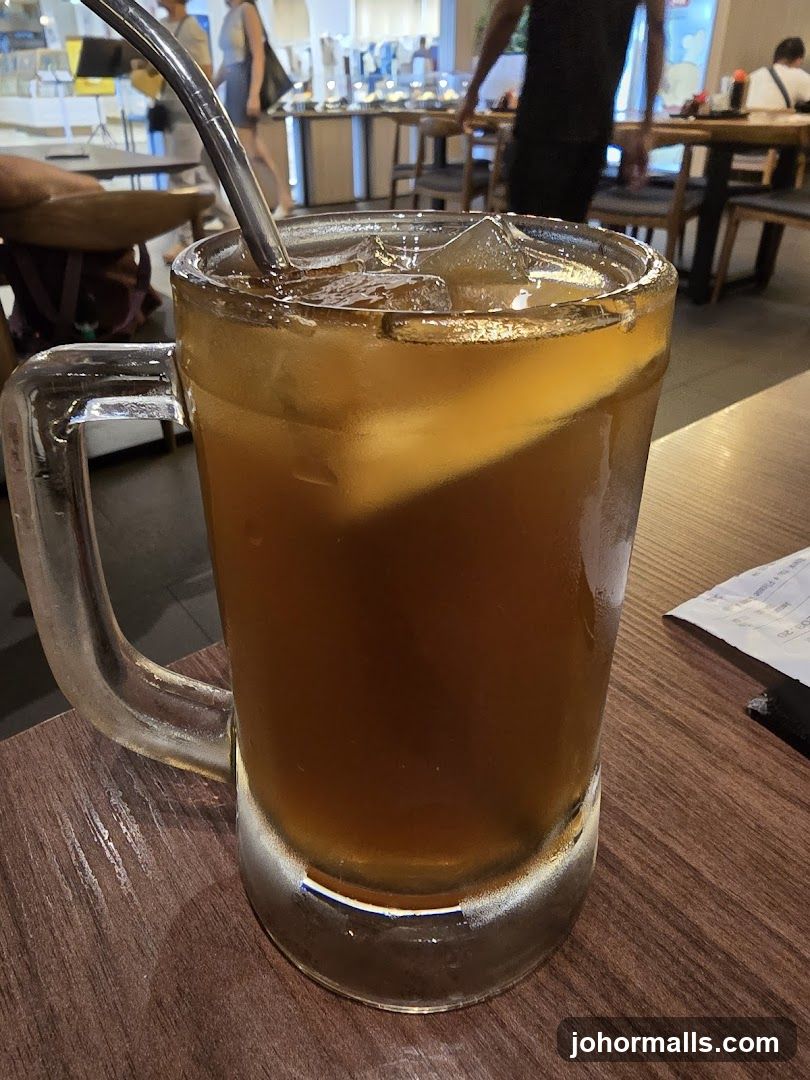 Iced beverage in mug with straw