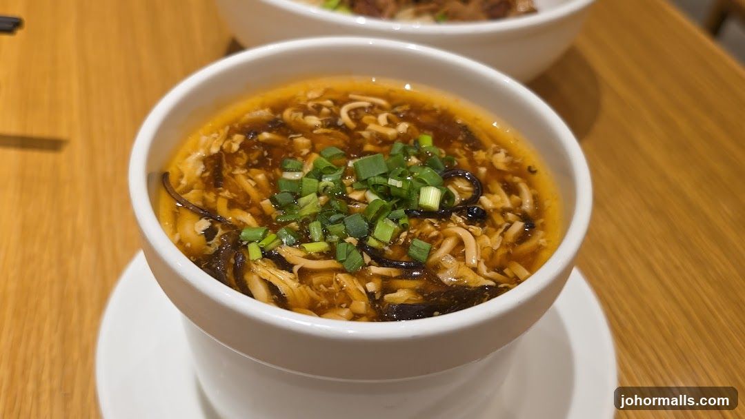 Bowl of soup on wooden table