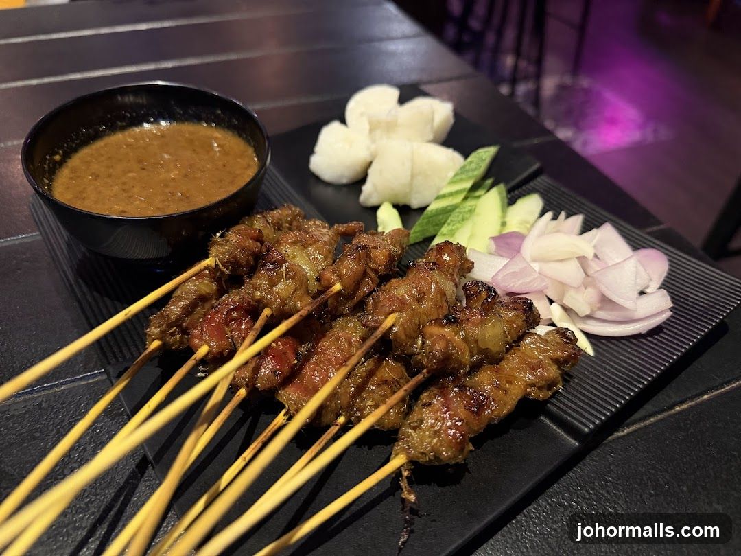 Grilled skewers with dipping sauce and accompaniments