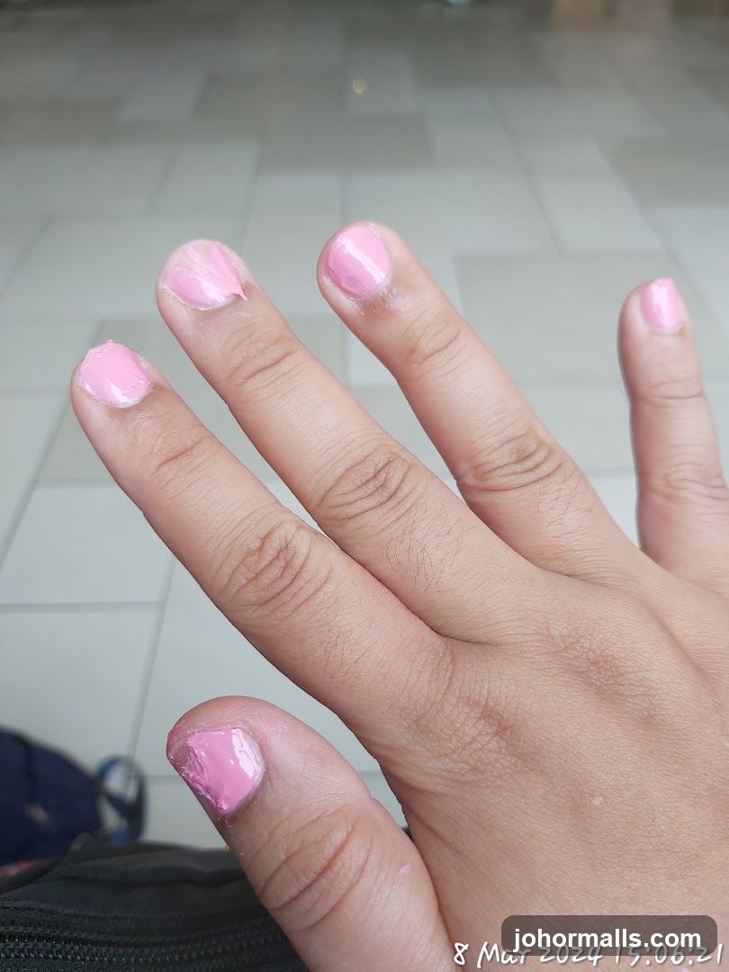 Hand with Pink Nail Polish