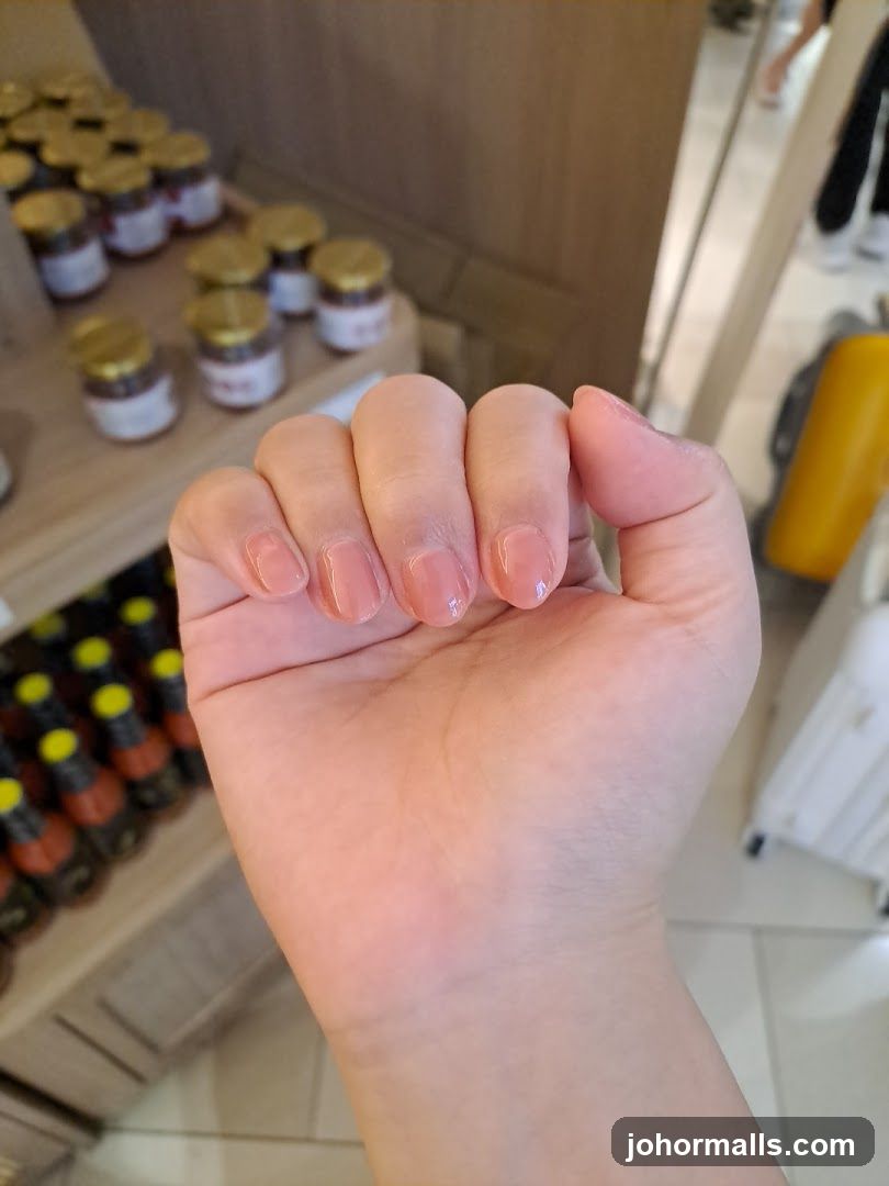 Hand with nails in store interior