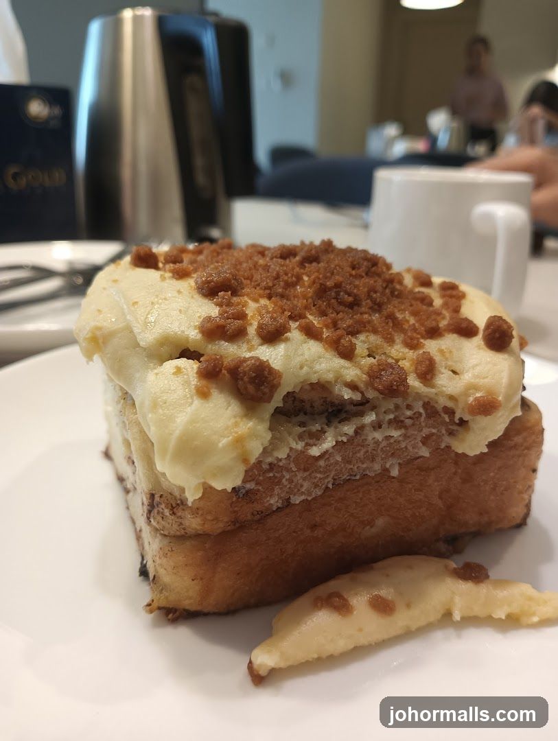 Cinnamon Roll with Creamy Frosting and Crumb Topping