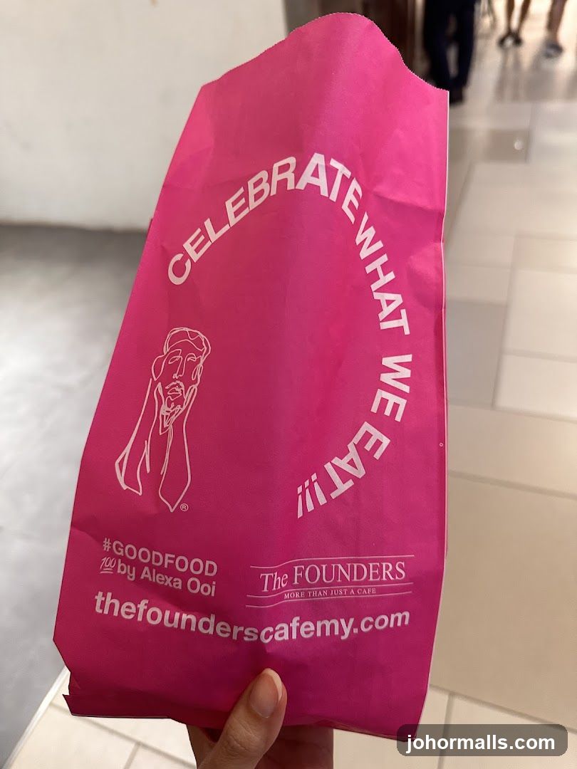 Pink branded bag from The Founders Cafe