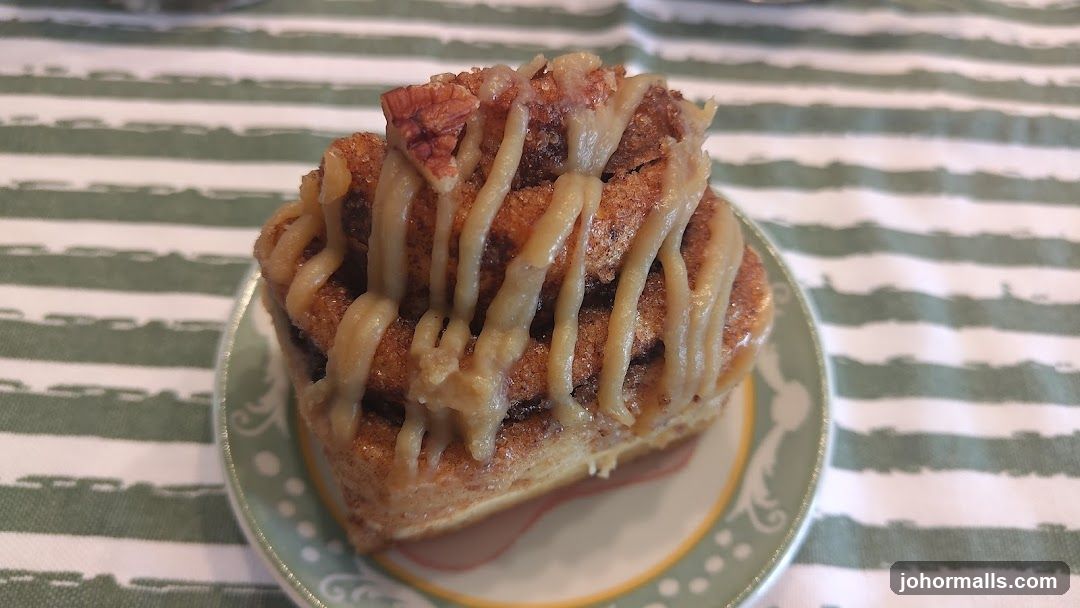 Cinnamon Roll with Drizzle and Nuts