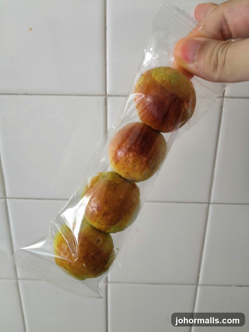 Hand holding packaged food item