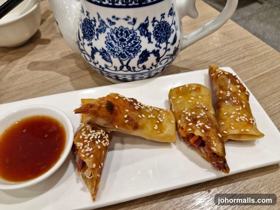 Dining Table with Spring Rolls and Teapot