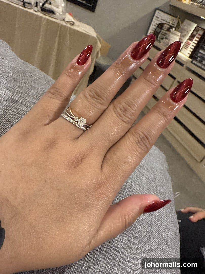 Hand with Red Nails and Ring