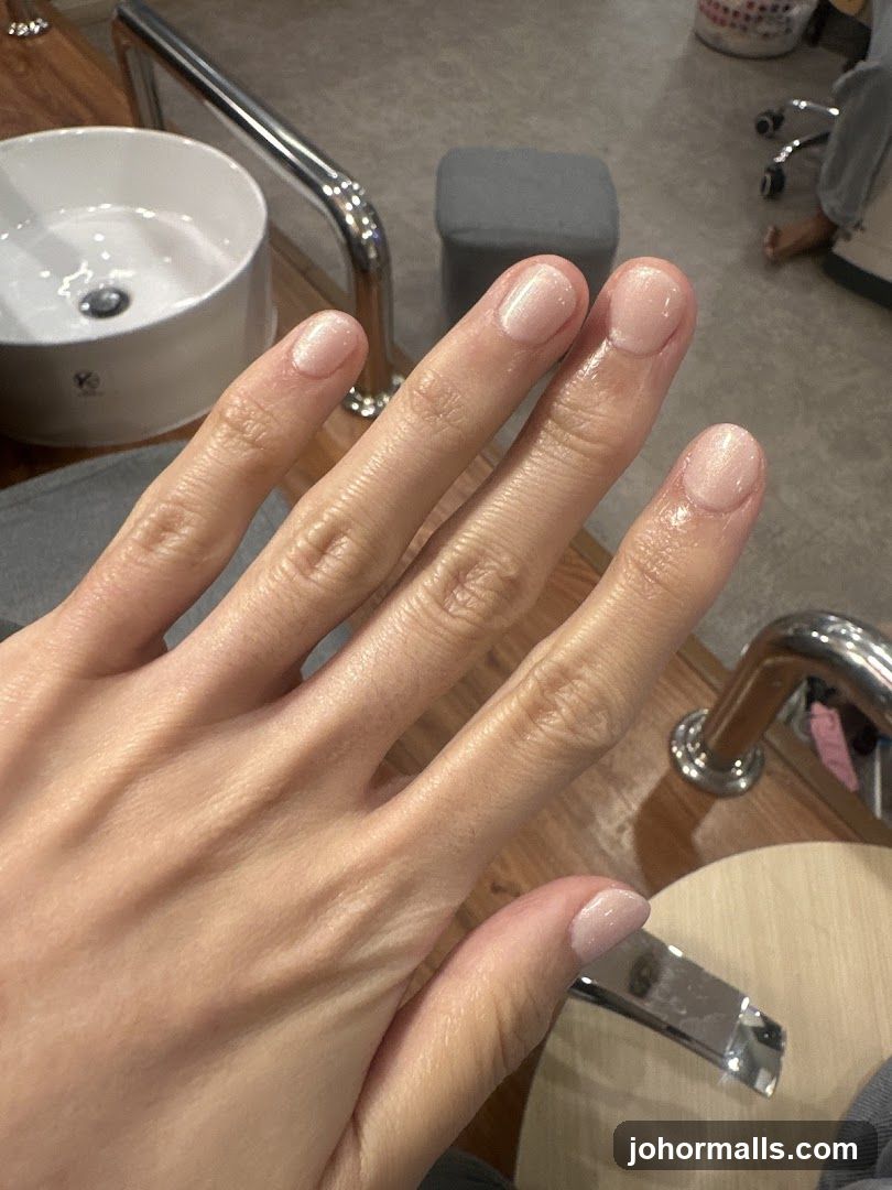 Hand with manicure in salon