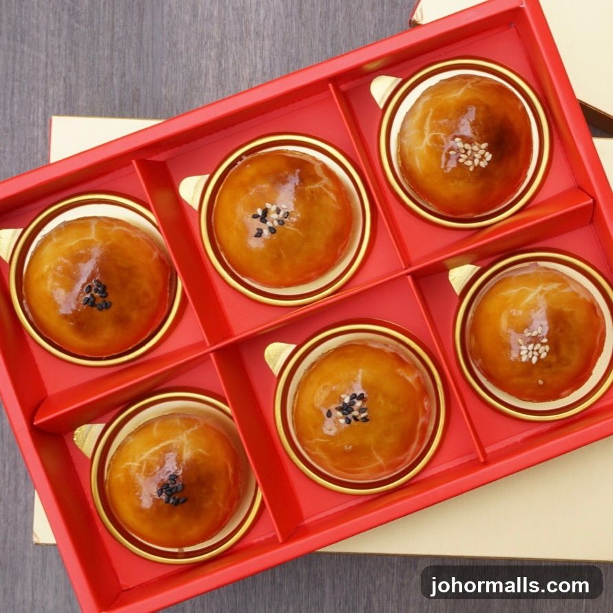 Red Box with Six Golden-Brown Pastries