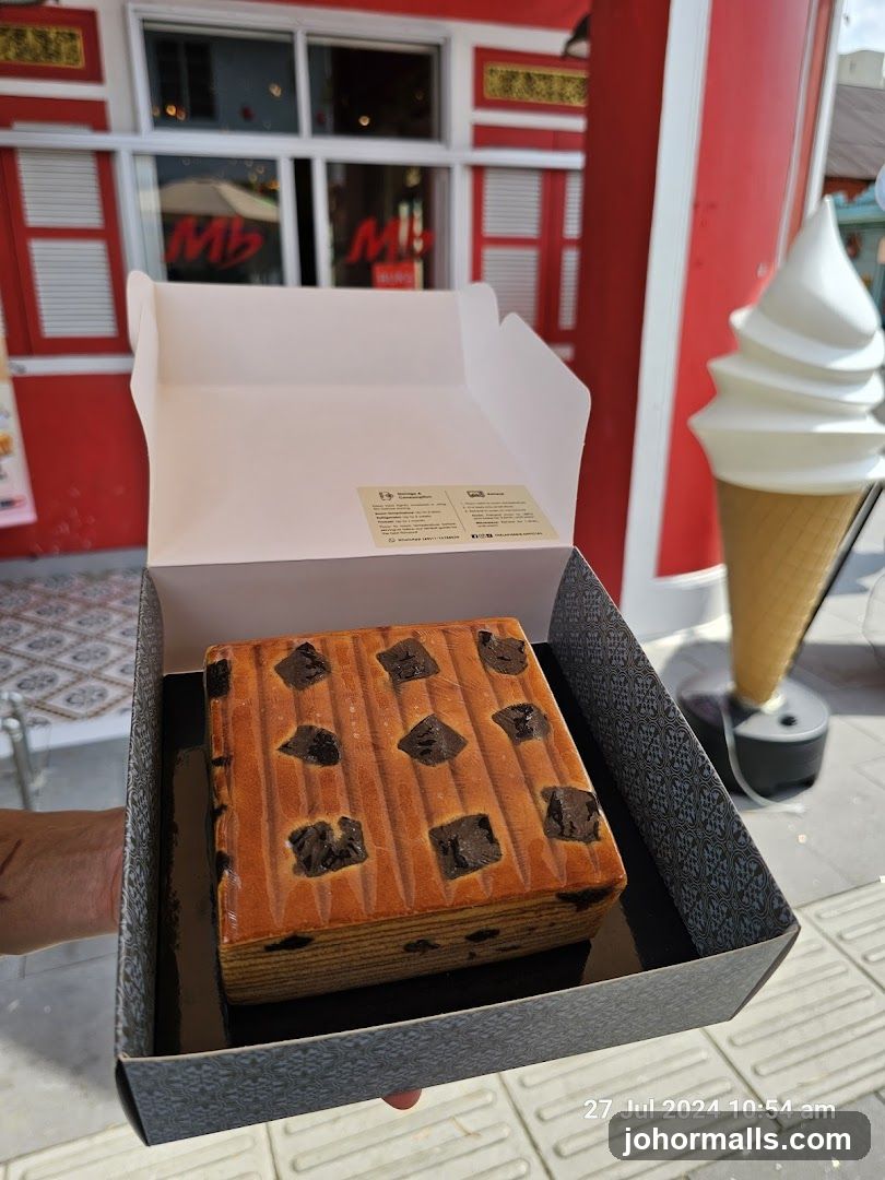 Cake in Box with Shop Front Background