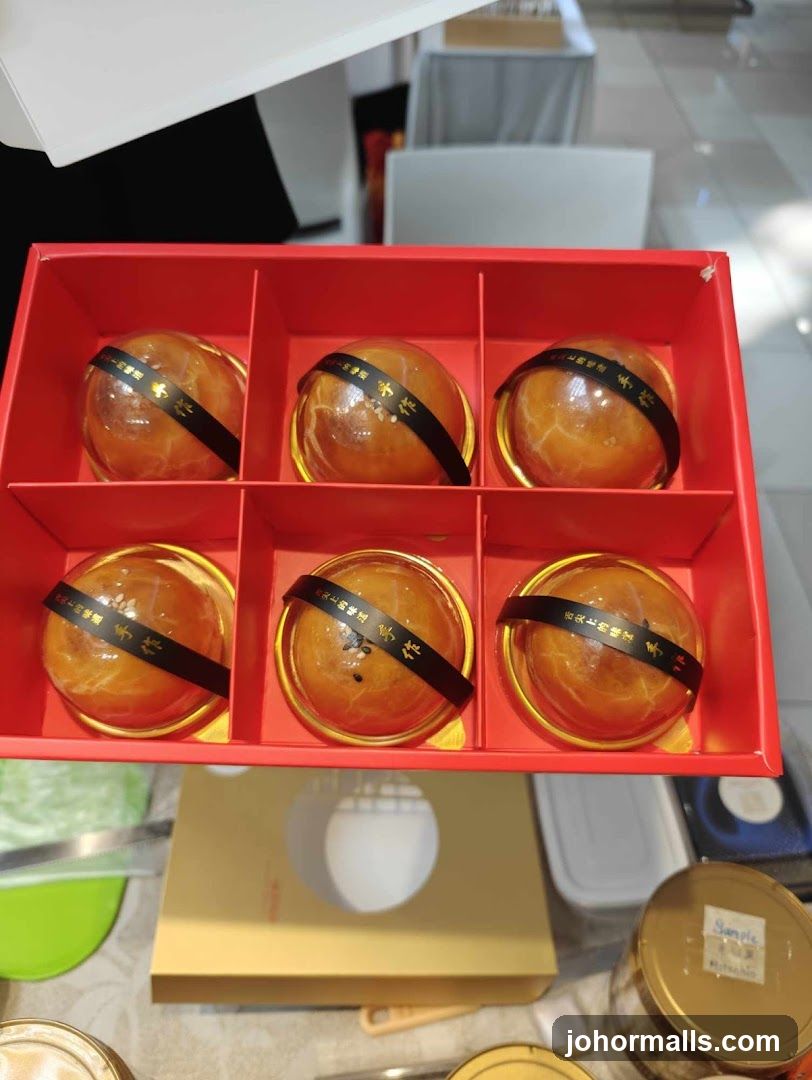Red Box with Six Golden-Brown Spheres