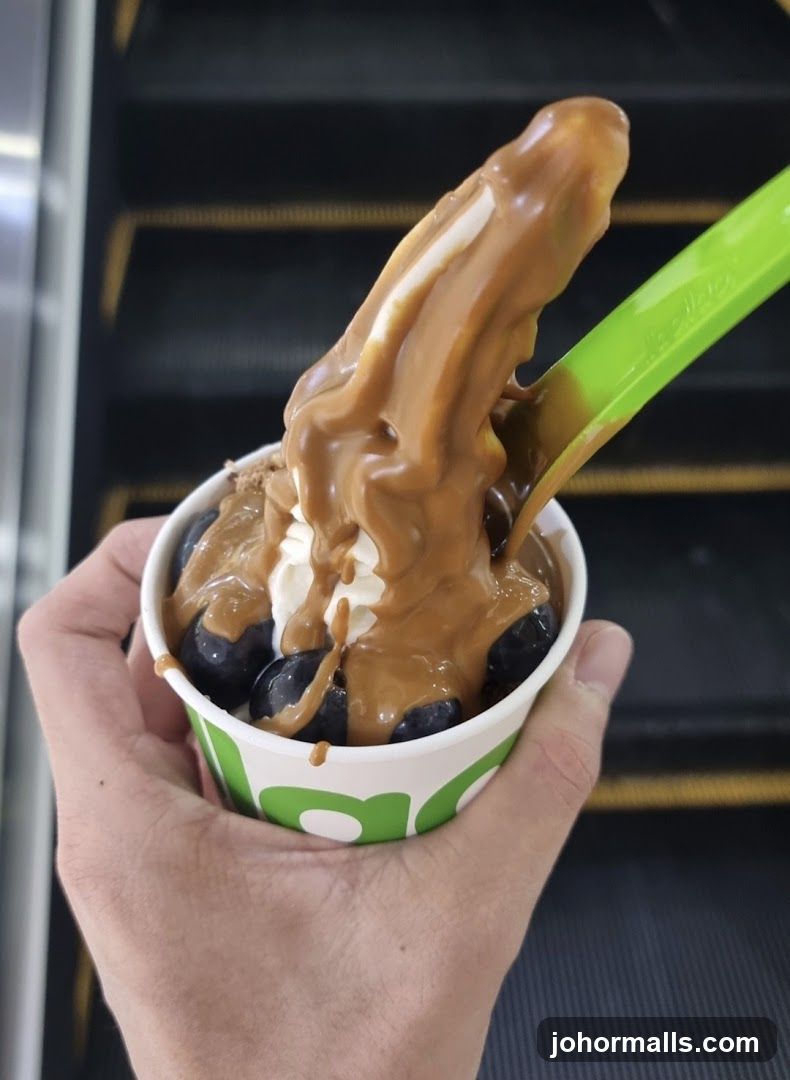 Hand holding dessert cup