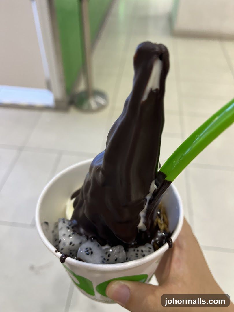 Hand holding dessert cup