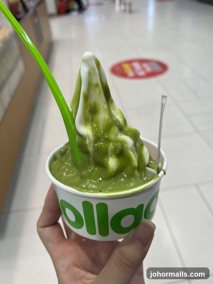 Hand holding matcha soft serve