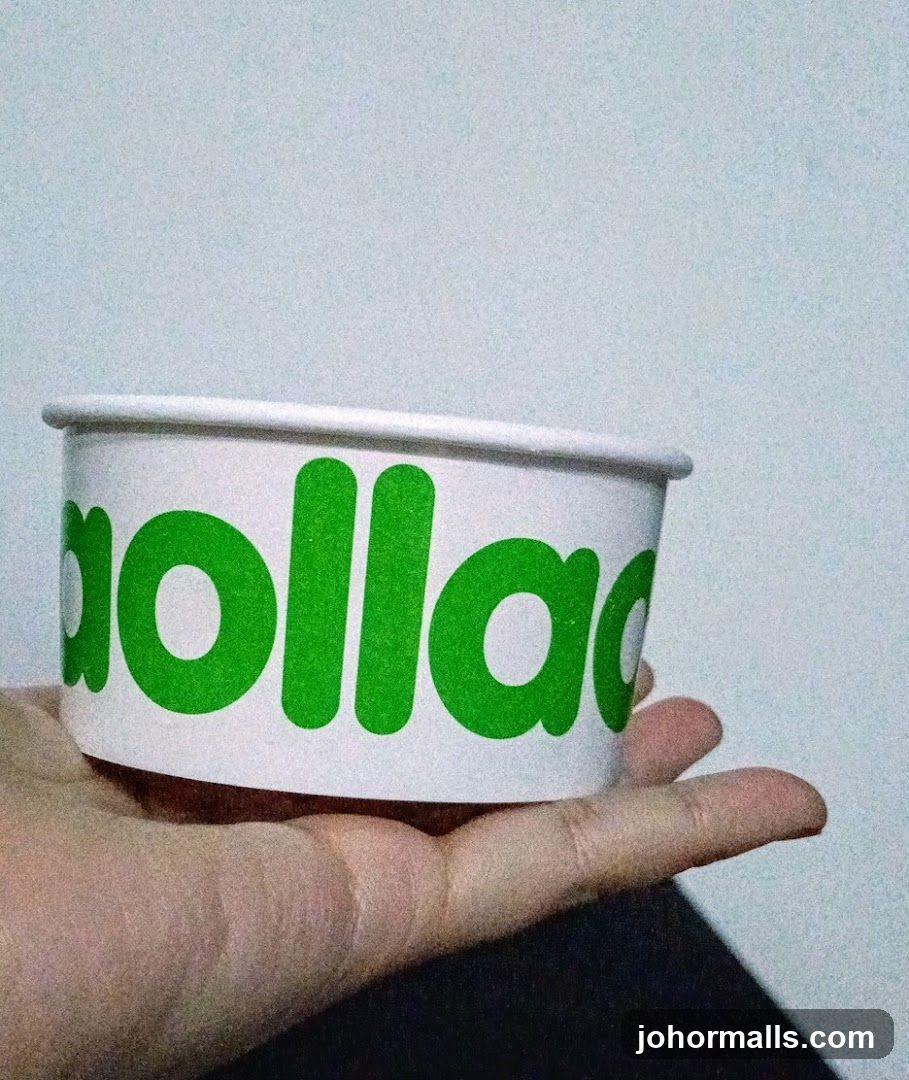Hand holding branded cup