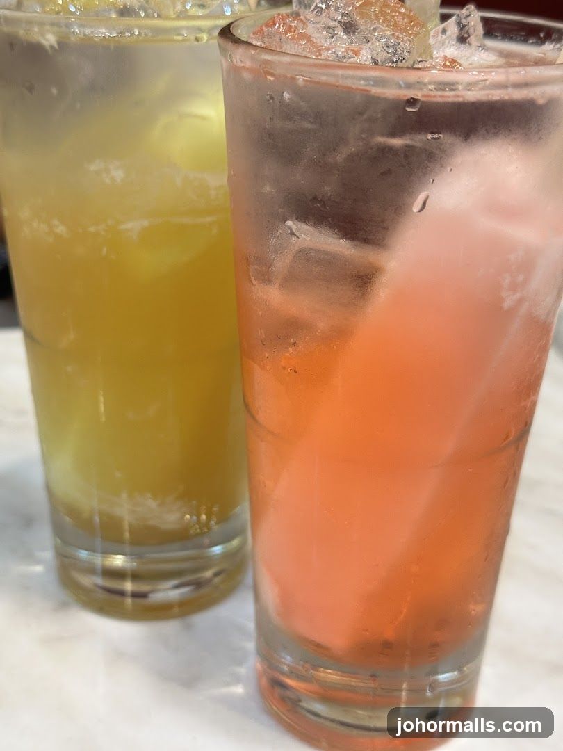 Two Iced Drinks on Marble Surface
