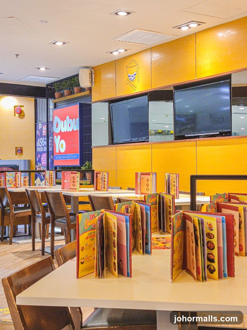 Restaurant Interior with Yellow Walls and Open Tables
