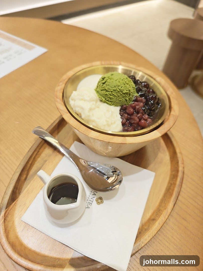 Bowl of dessert with side sauce