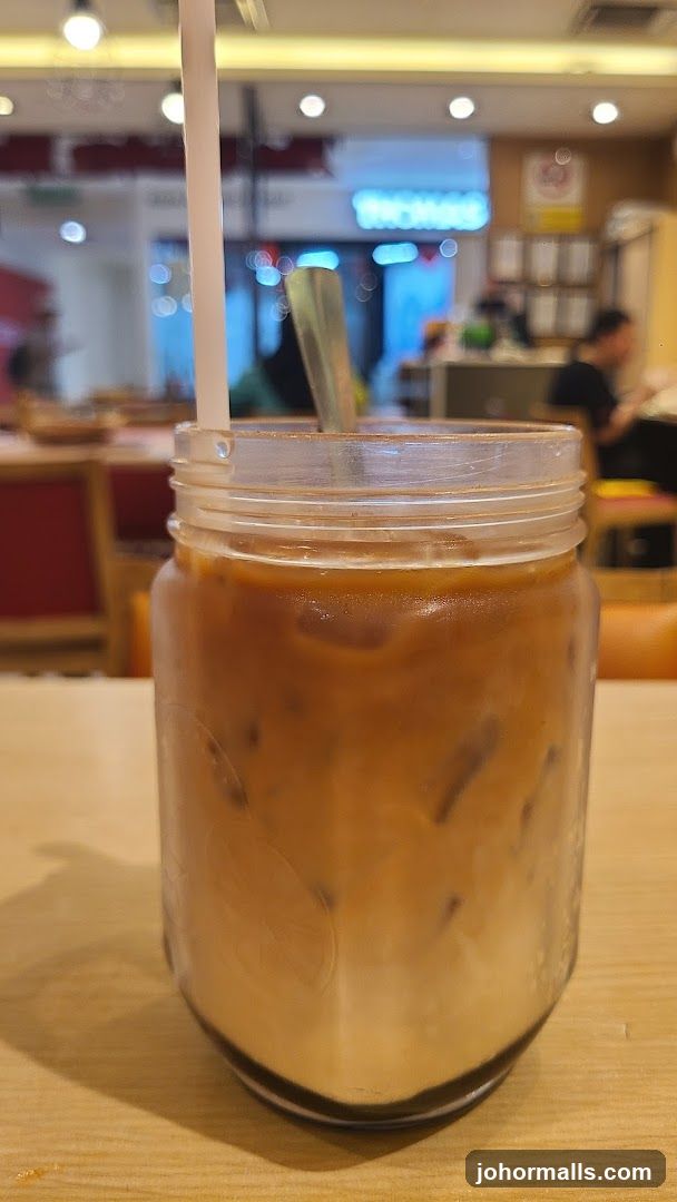 Iced beverage in mason jar at café