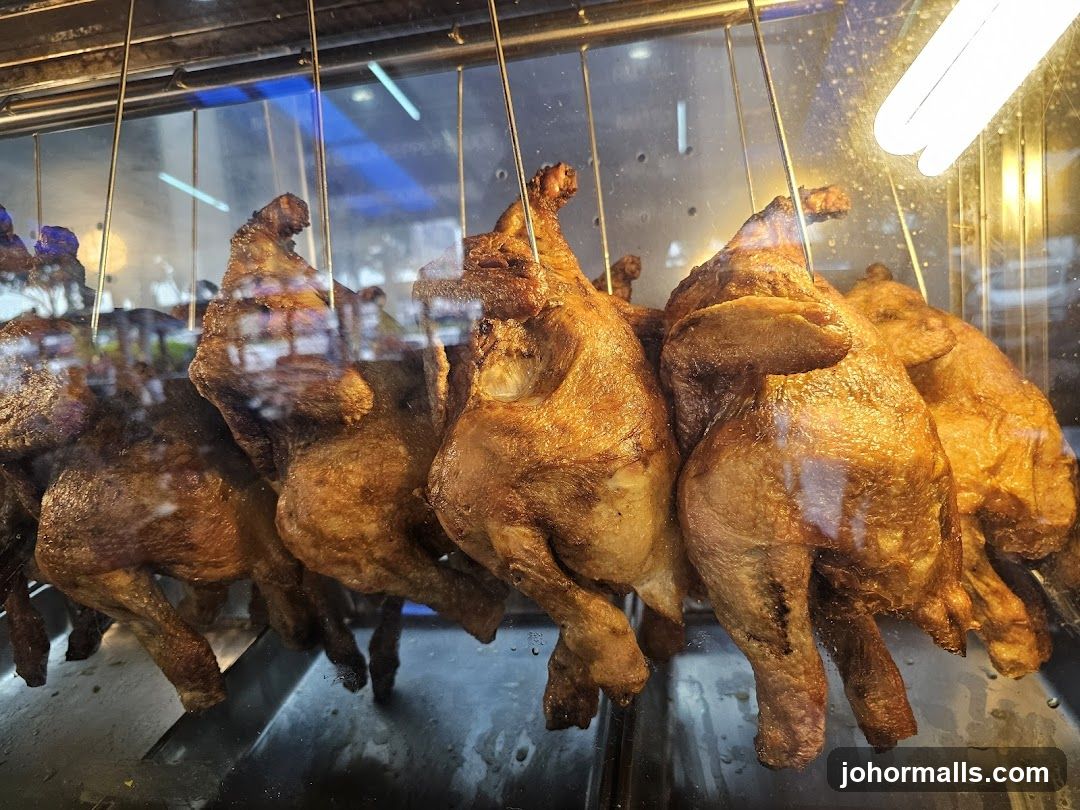 Roasted chickens in display case