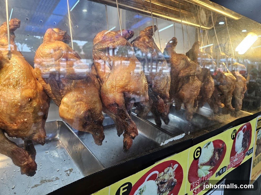 Roasted chickens displayed in a food stall