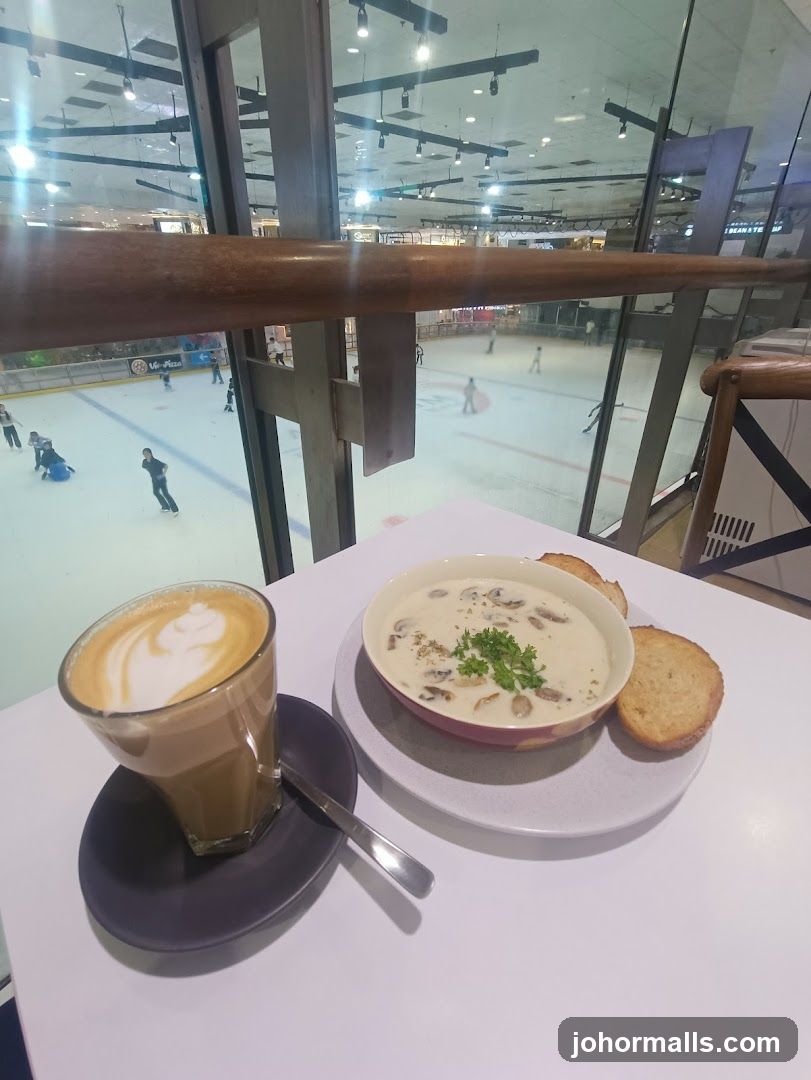 Table with food and drink overlooking ice rink