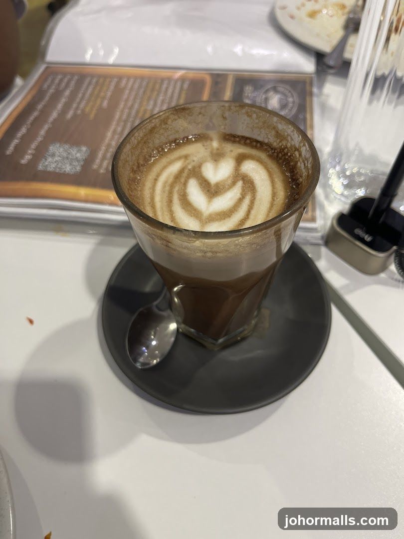 Coffee with latte art on table