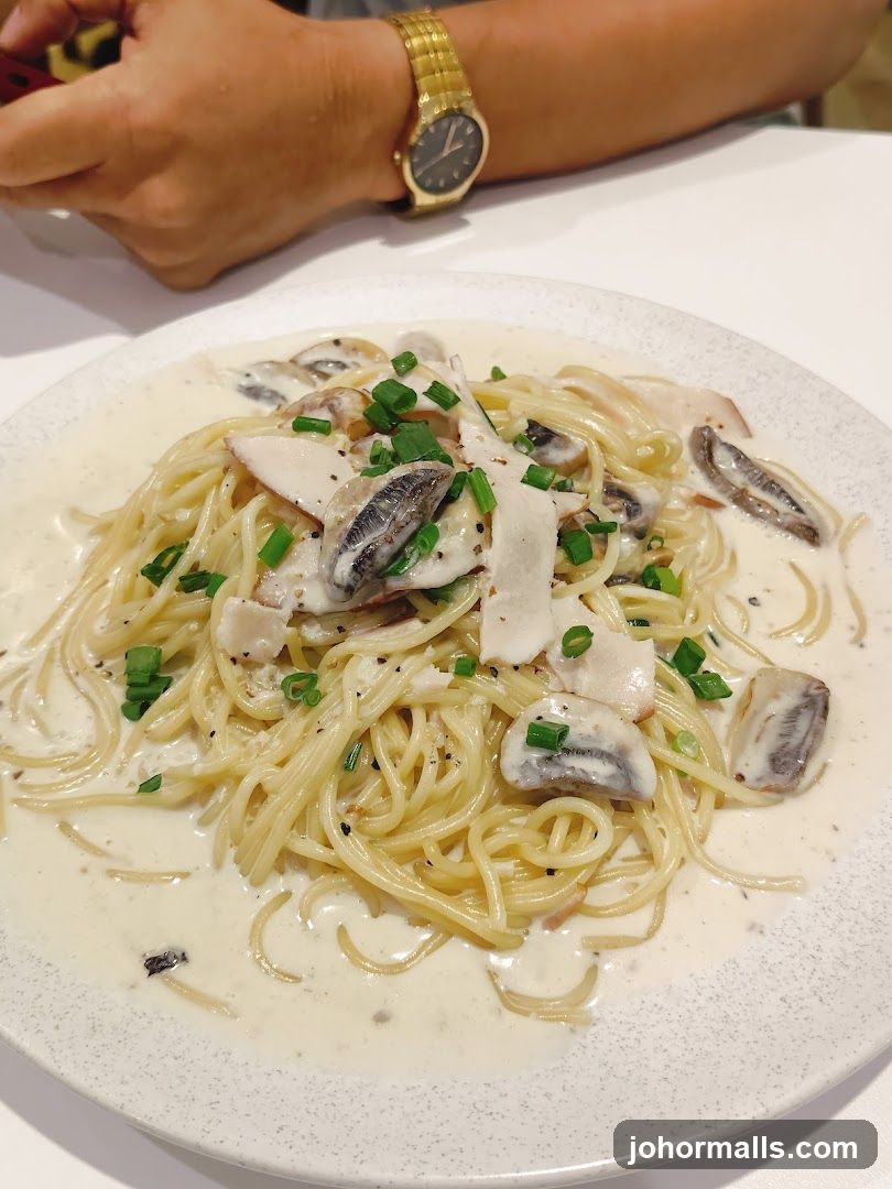 Pasta dish with cream sauce and mushrooms