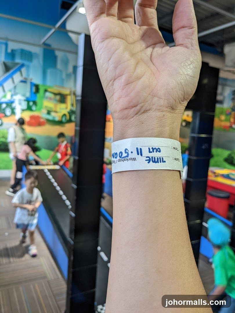 Hand with wristband in indoor setting