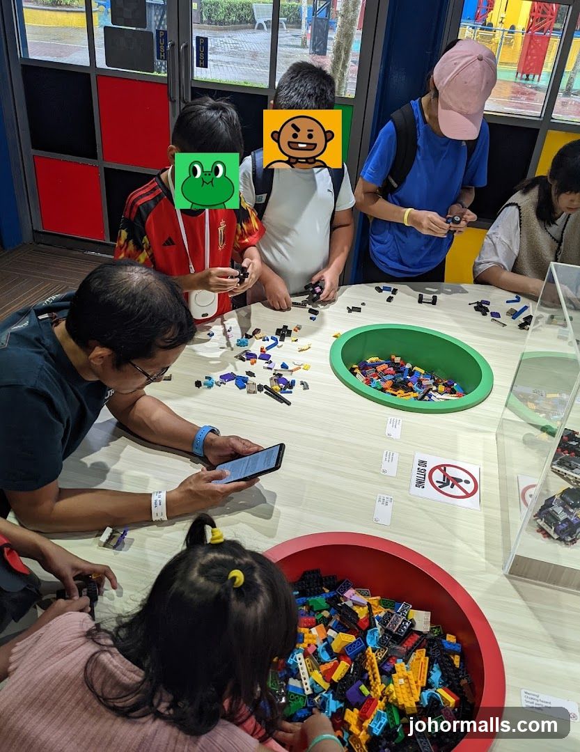 Group of people building LEGO at a table