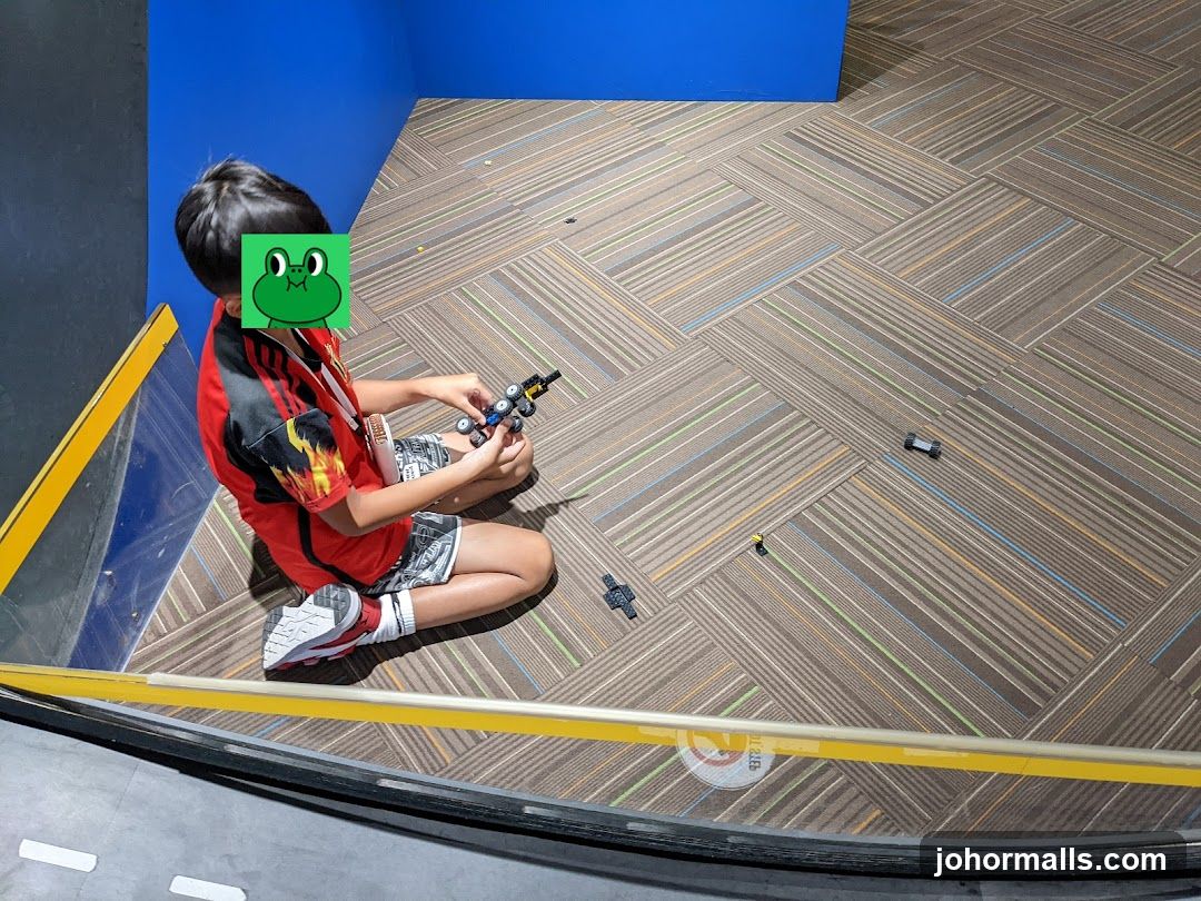 Child playing with toy cars indoors
