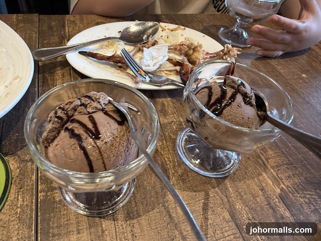 Table with ice cream and remnants of meal