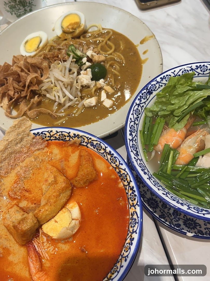 Table with three dishes of Malaysian cuisine