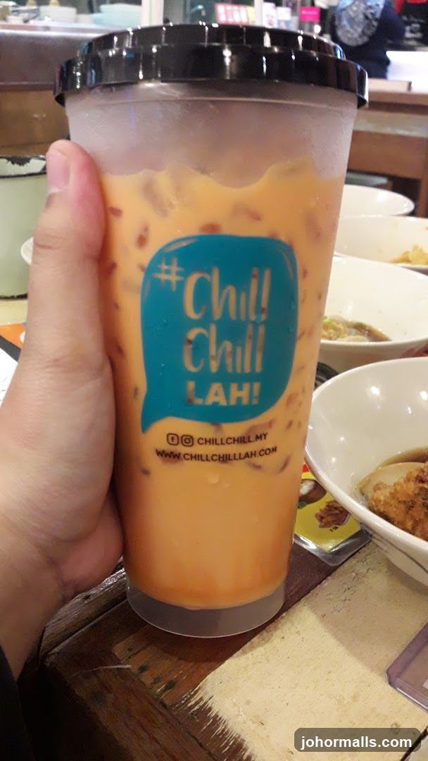 Hand holding iced beverage