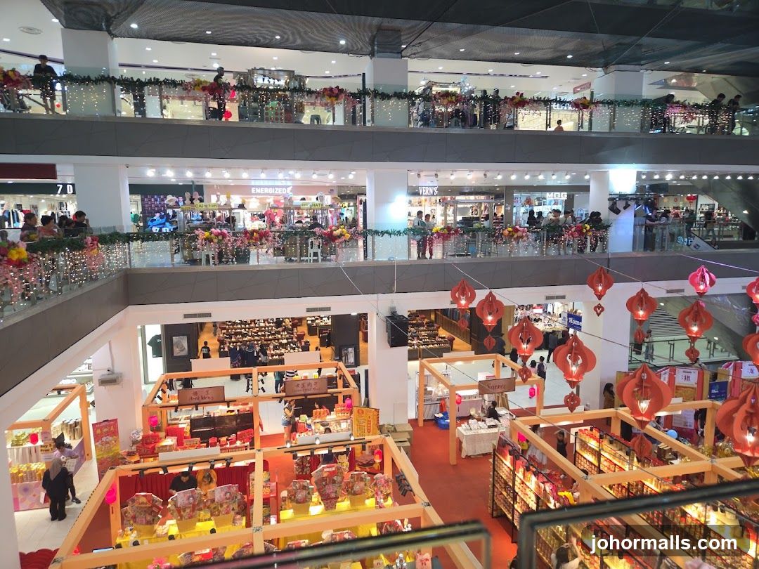 Multi-level shopping mall interior during festive season