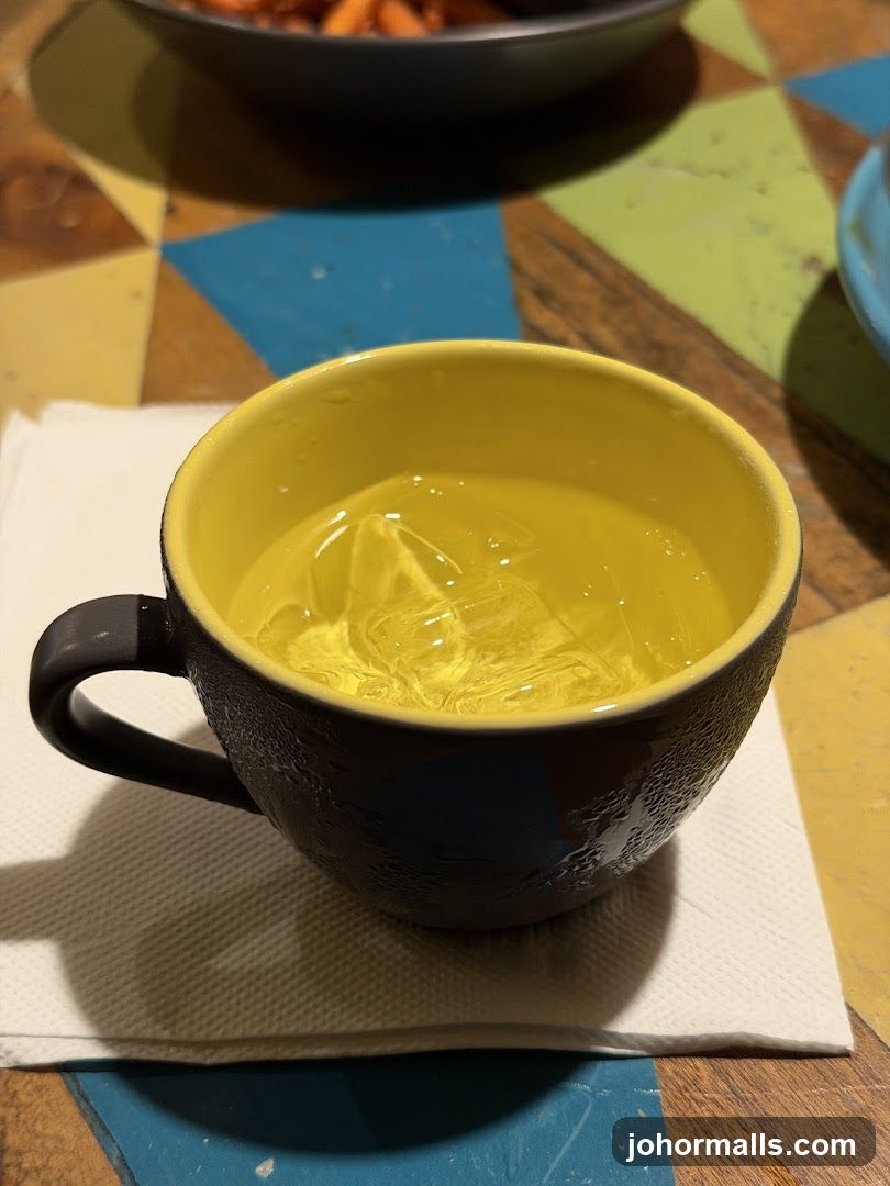 Cup of iced beverage on colorful table
