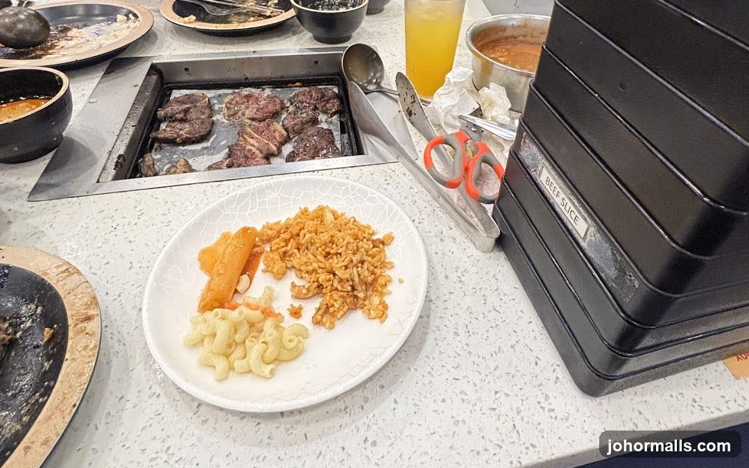 Buffet Table with Grilled Meat and Sides