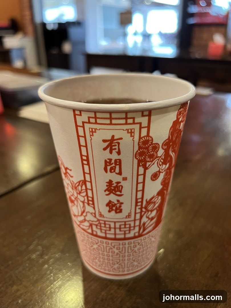 Paper cup with Chinese characters and floral design