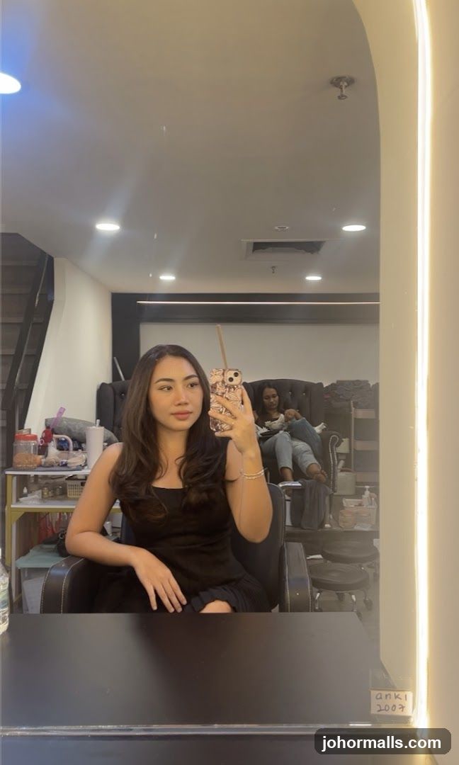 Woman taking a selfie in a salon