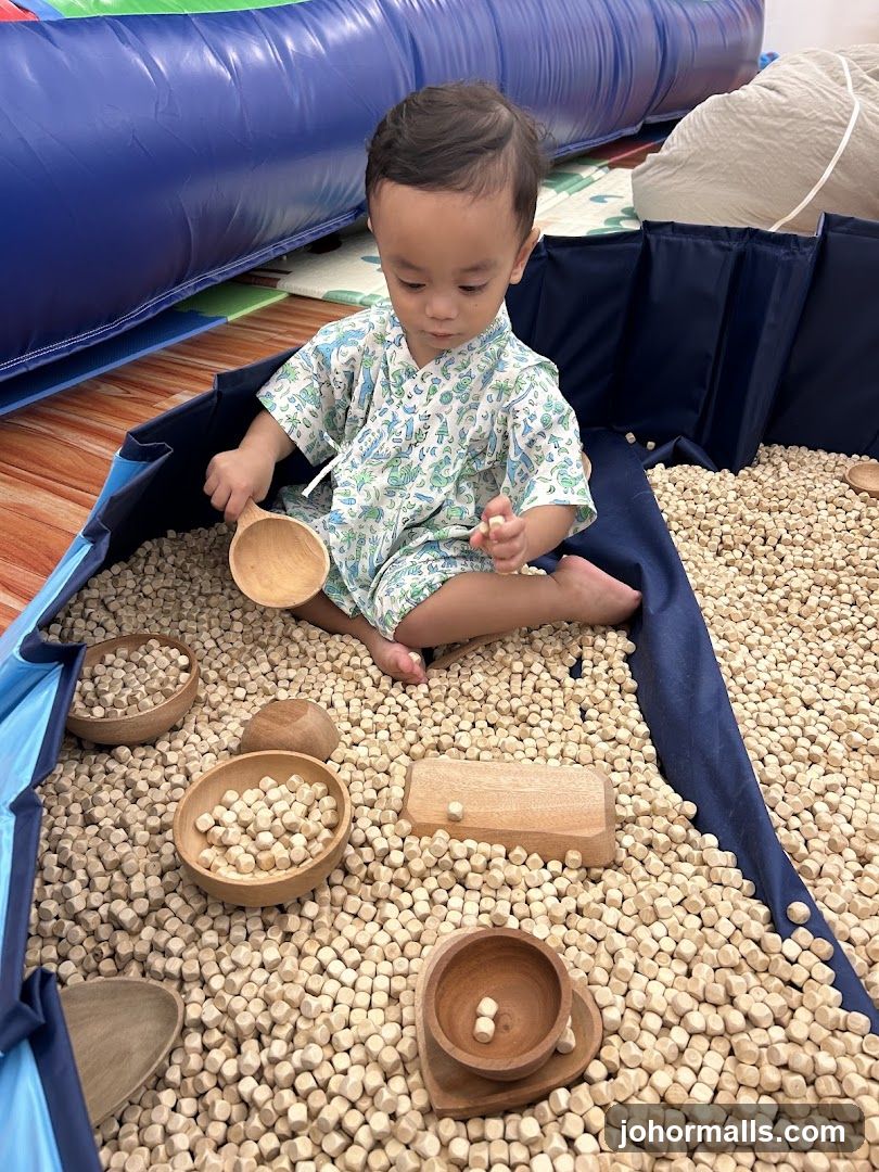 Toddler Playing in Ball Pit