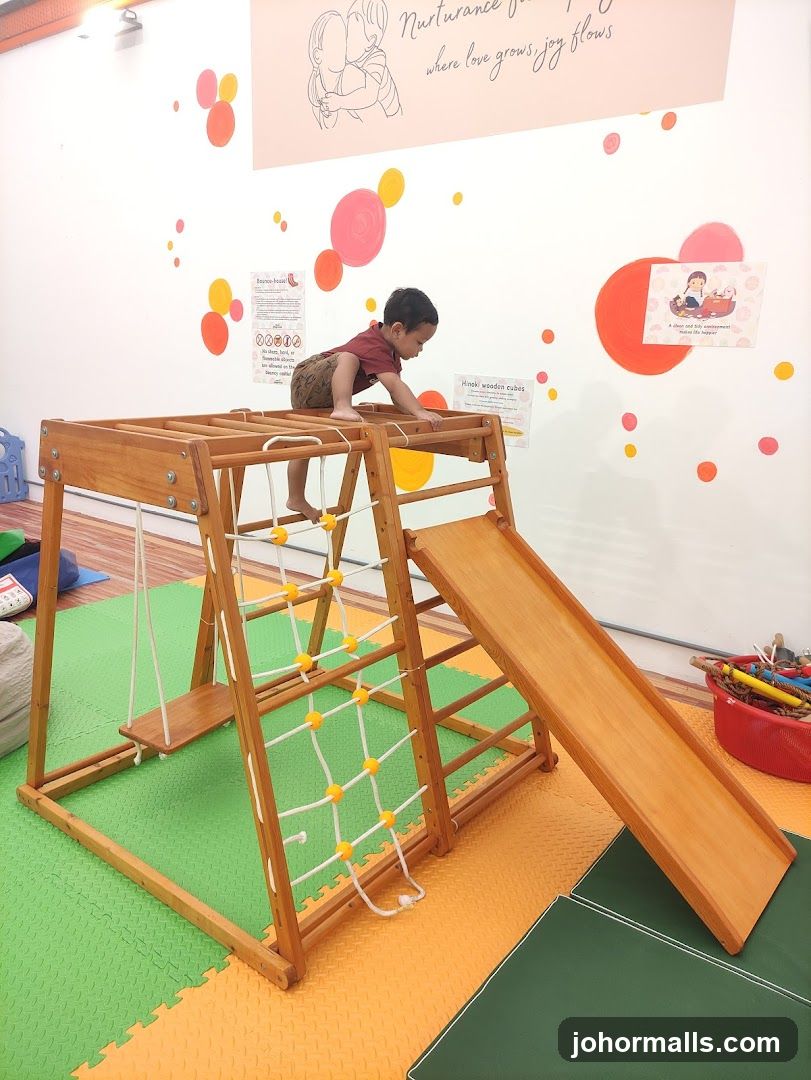 Child playing on indoor playground equipment