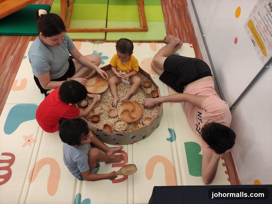Children and adults playing with sensory bin